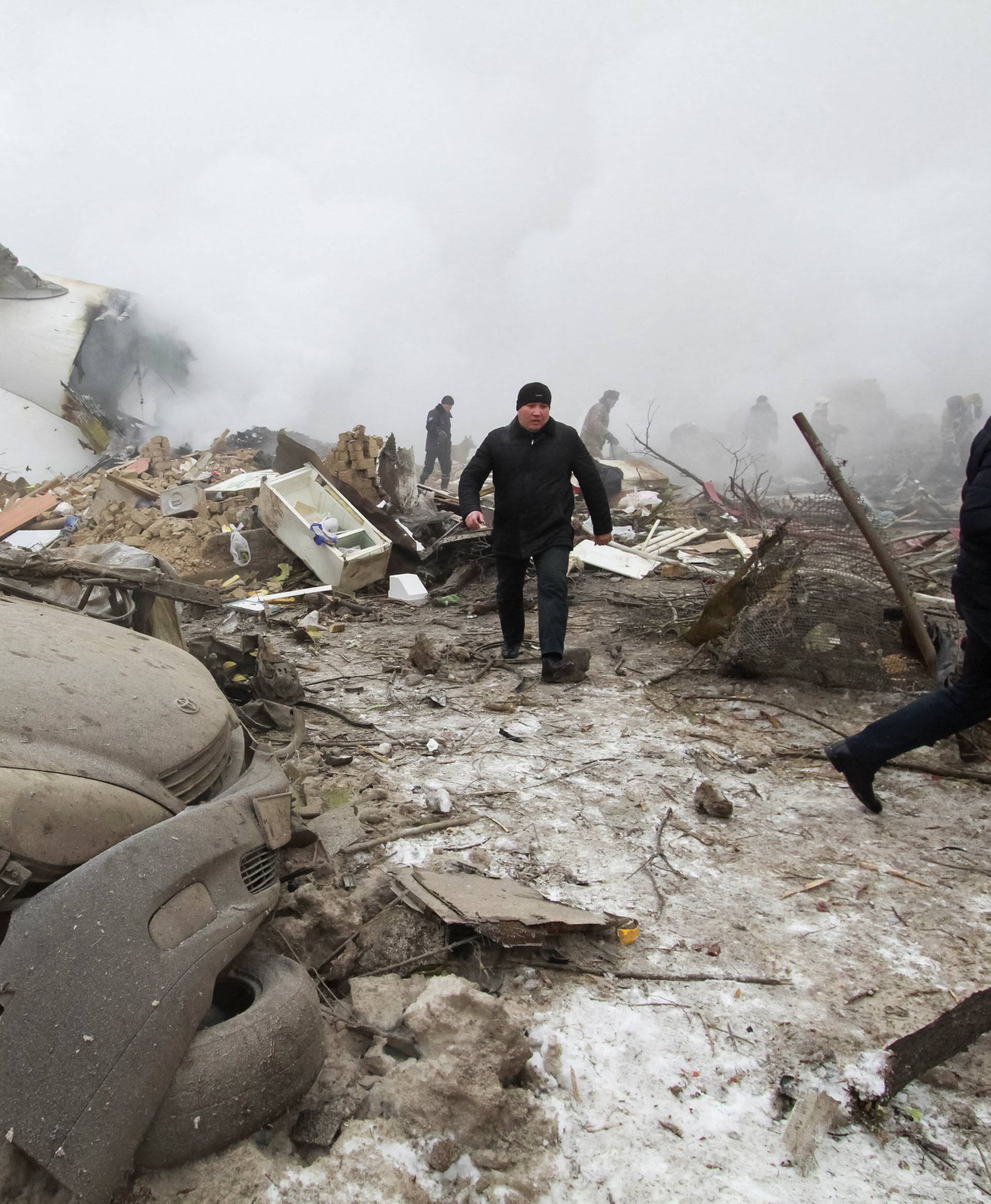 Rescue teams are seen are seen at the crash site of a Turkish cargo jet near Kyrgyzstan's Manas airport outside Bishkek