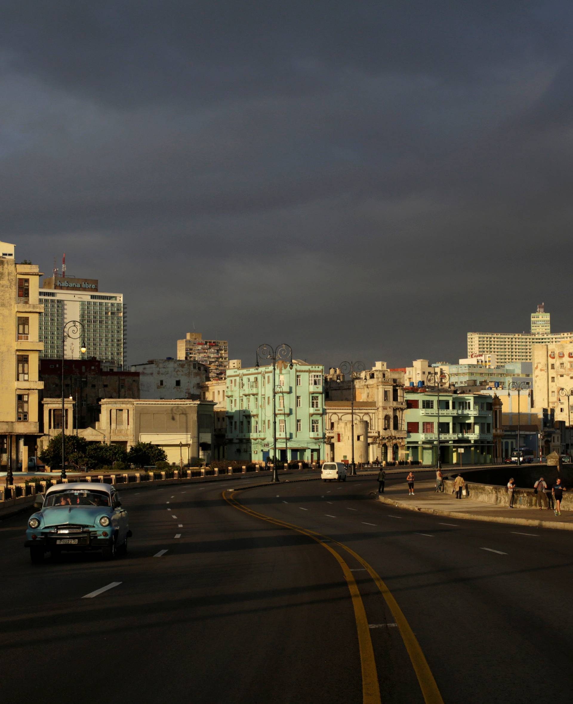 The sun rises at dawn over Havana's seafront boulevard "El Malecon", Cuba