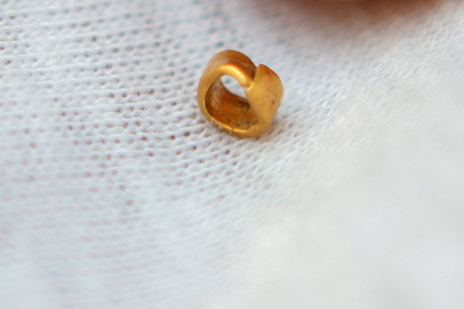 A 15-centigrams gold bead is pictured in village of Yunatsite