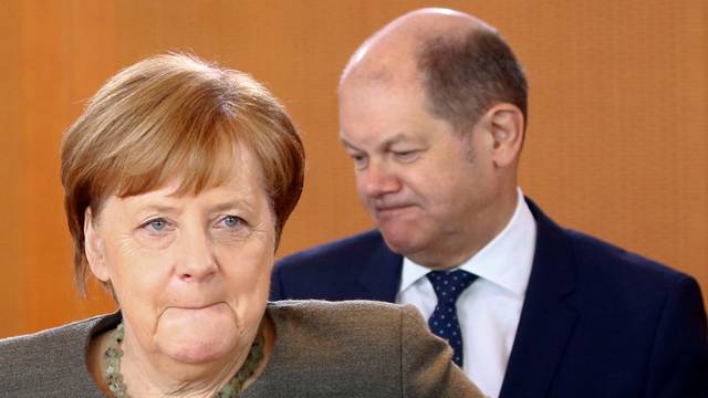 German Chancellor Angela Merkel and Finance Minister Olaf Scholz attend the cabinet meeting in Berlin