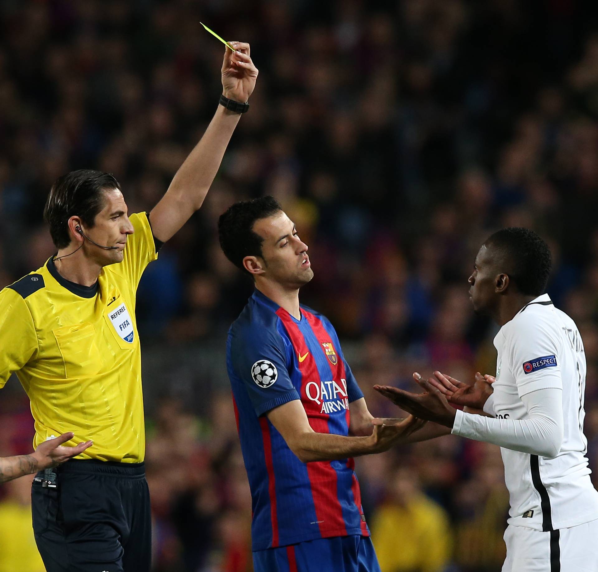 Paris Saint-Germain's Blaise Matuidi is shown a yellow card by referee Deniz Aytekin