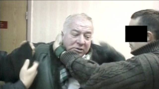 A still image taken from an undated video shows Sergei Skripal, a former colonel of Russia's GRU military intelligence service, being detained by secret service officers in an unknown location.
