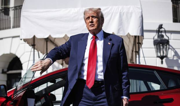 Trump views Tesla Vehicles on the South Lawn Driveway of The White House