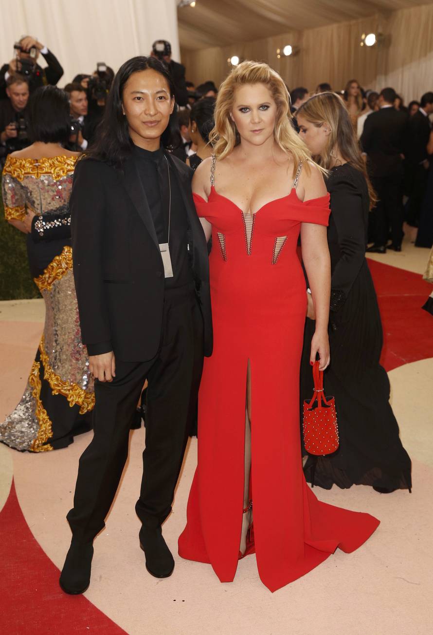 Actress Schumer and designer Wang arrive at the Met Gala in New York