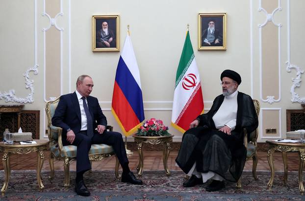 FILE PHOTO: Russian President Putin and Iranian President Raisi meet in Tehran