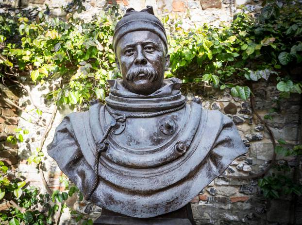 Statue of William Walker, a deep-sea diver who worked under water for six years to underpin the waterlogged foundations of Winchester Cathedral