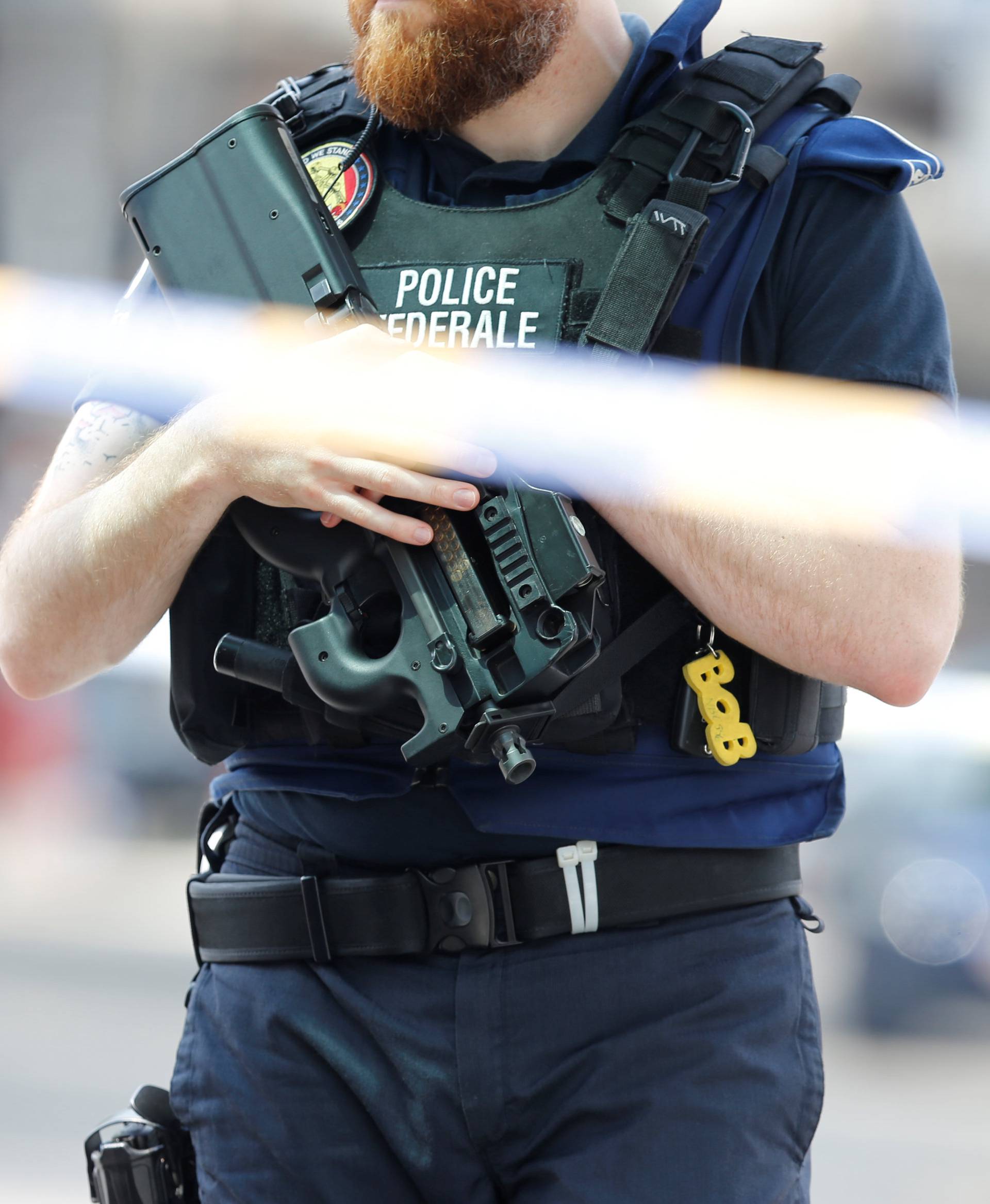 A police officer is seen on the scene of a shooting in Liege