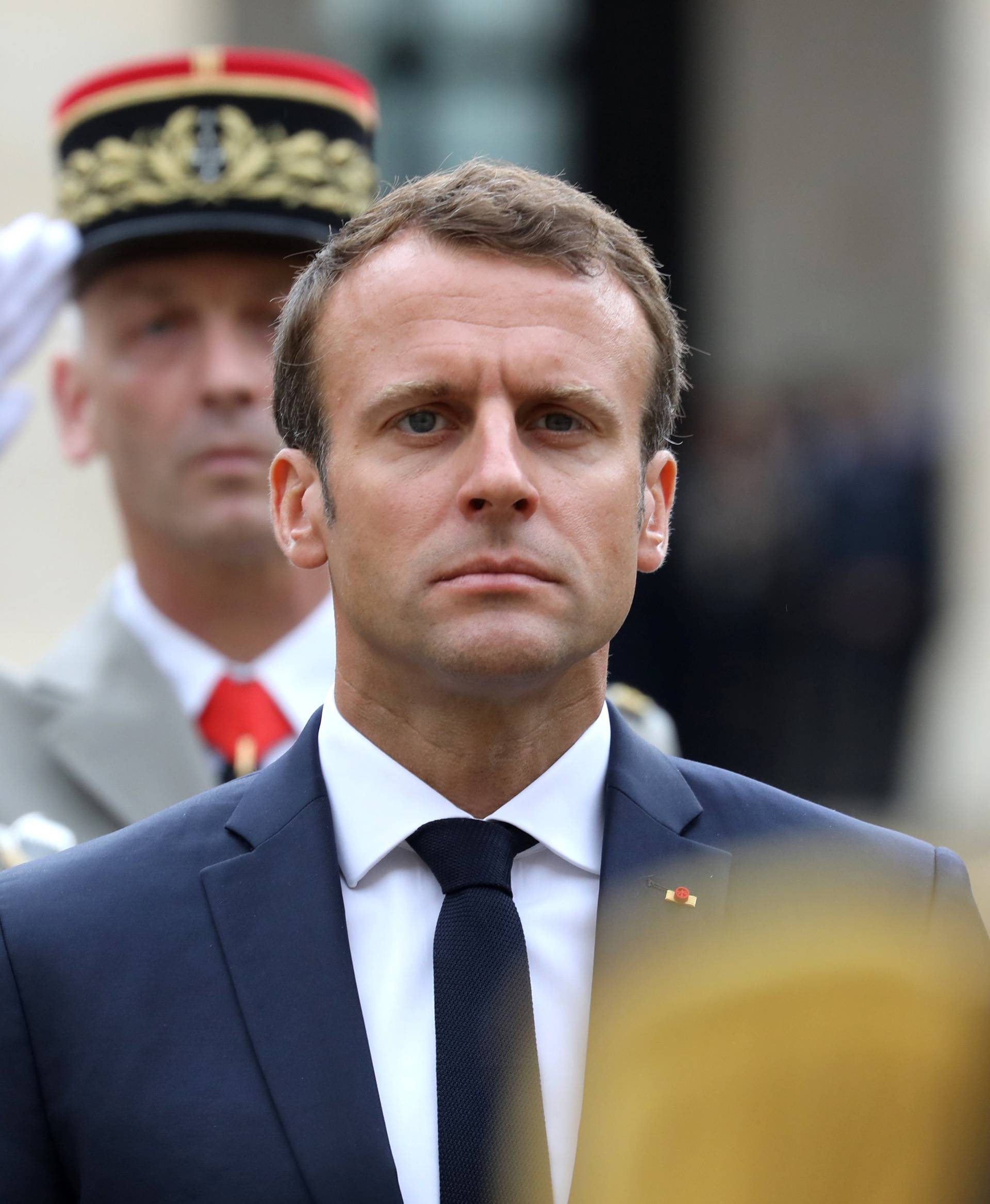 French President Emmanuel Macron attends the "prise d'armes" military ceremony at the Invalides in Paris