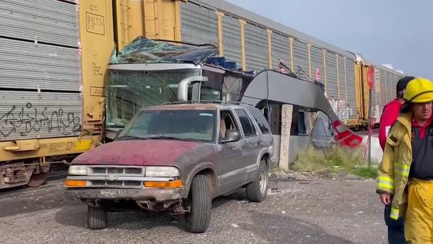 Emergency teams respond to train’s collision with bus in Mexico