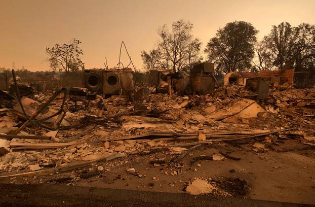 A burned out home in the small community of Keswick is shown from wildfire damage near Redding, California