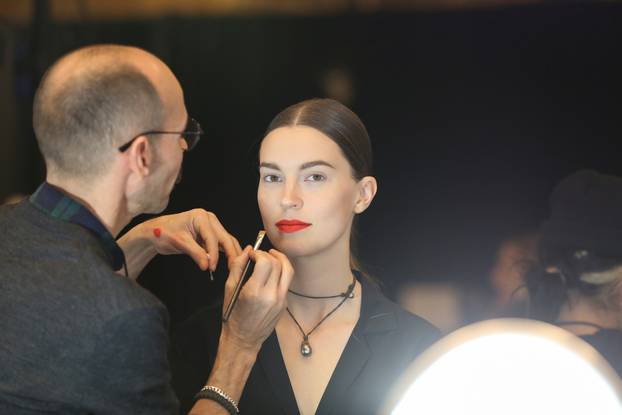 Models are prepped backstage before presenting creations from the Oscar de la Renta Fall 2020 collection during New York Fashion Week