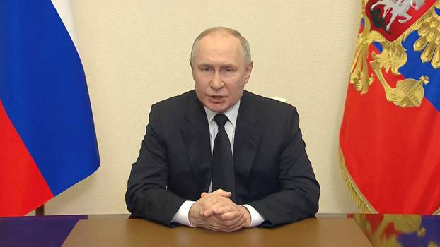 FILE PHOTO: Russian President Vladimir Putin delivers a video address to the nation