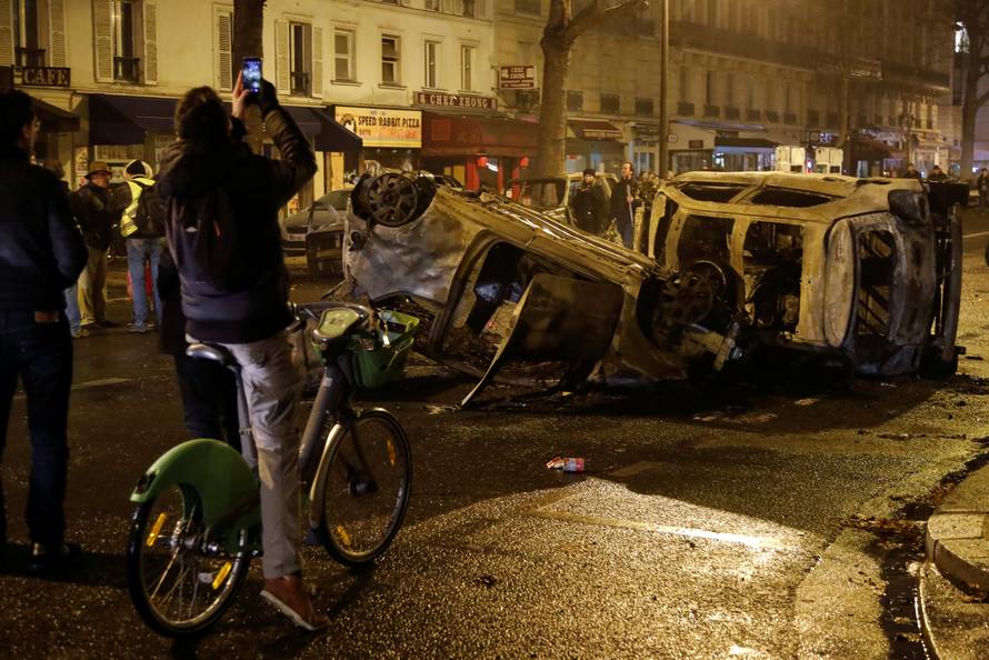 Burned cars are seen on avenue Kleber after clashes with protesters wearing yellow vests, a symbol of a French drivers' protest against higher diesel taxes, in Paris