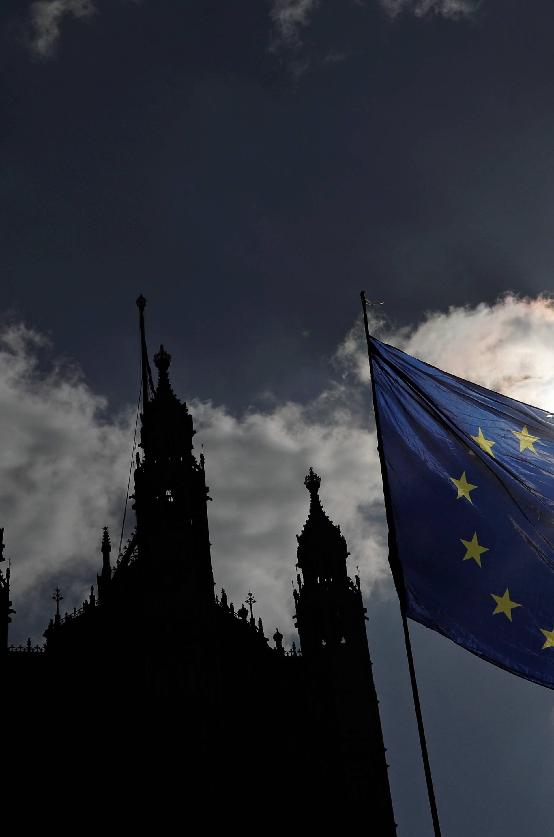 EU flag flutters outside the Houses of Parliament in London