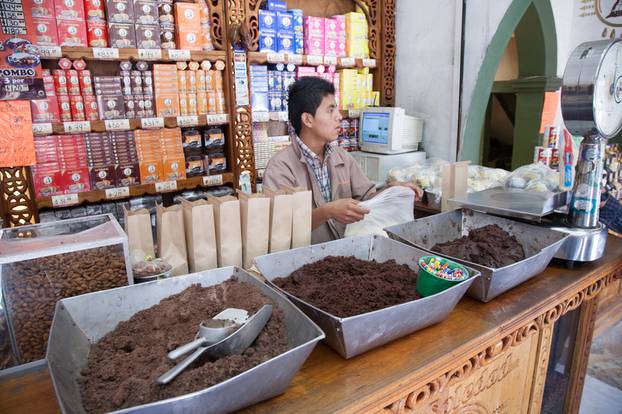 Worker in a chocolate and mole shop  selling chocolate in Oaxaca