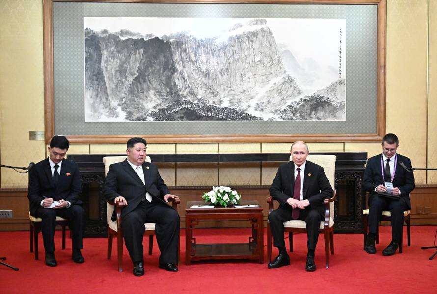 Russian President Vladimir Putin meets with North Korean leader Kim Jong Un in Beijing