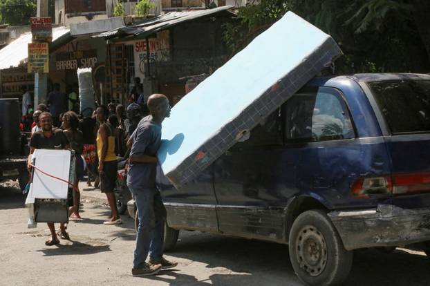 Haitians flee homes due to gang violence, in Port-au-Prince