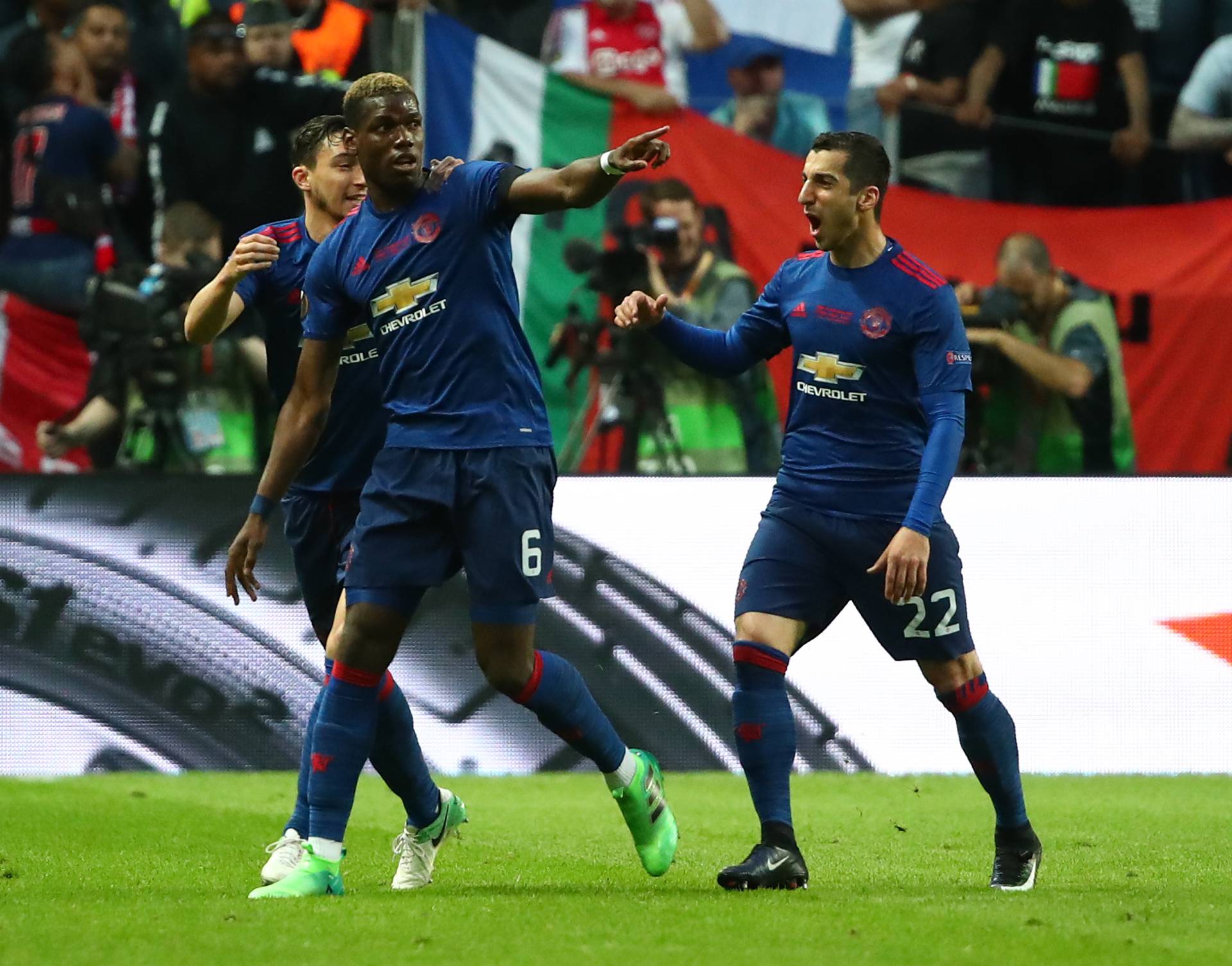 Manchester United's Paul Pogba celebrates scoring their first goal with Henrikh Mkhitaryan and Matteo Darmian