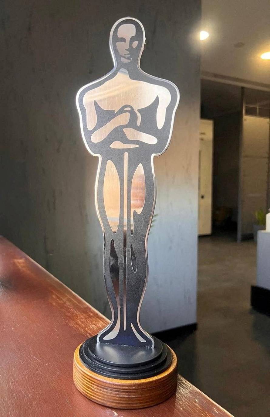 An award given to actor Sean Penn by Oleksandr Pertsovskyi in this picture obtained from social media