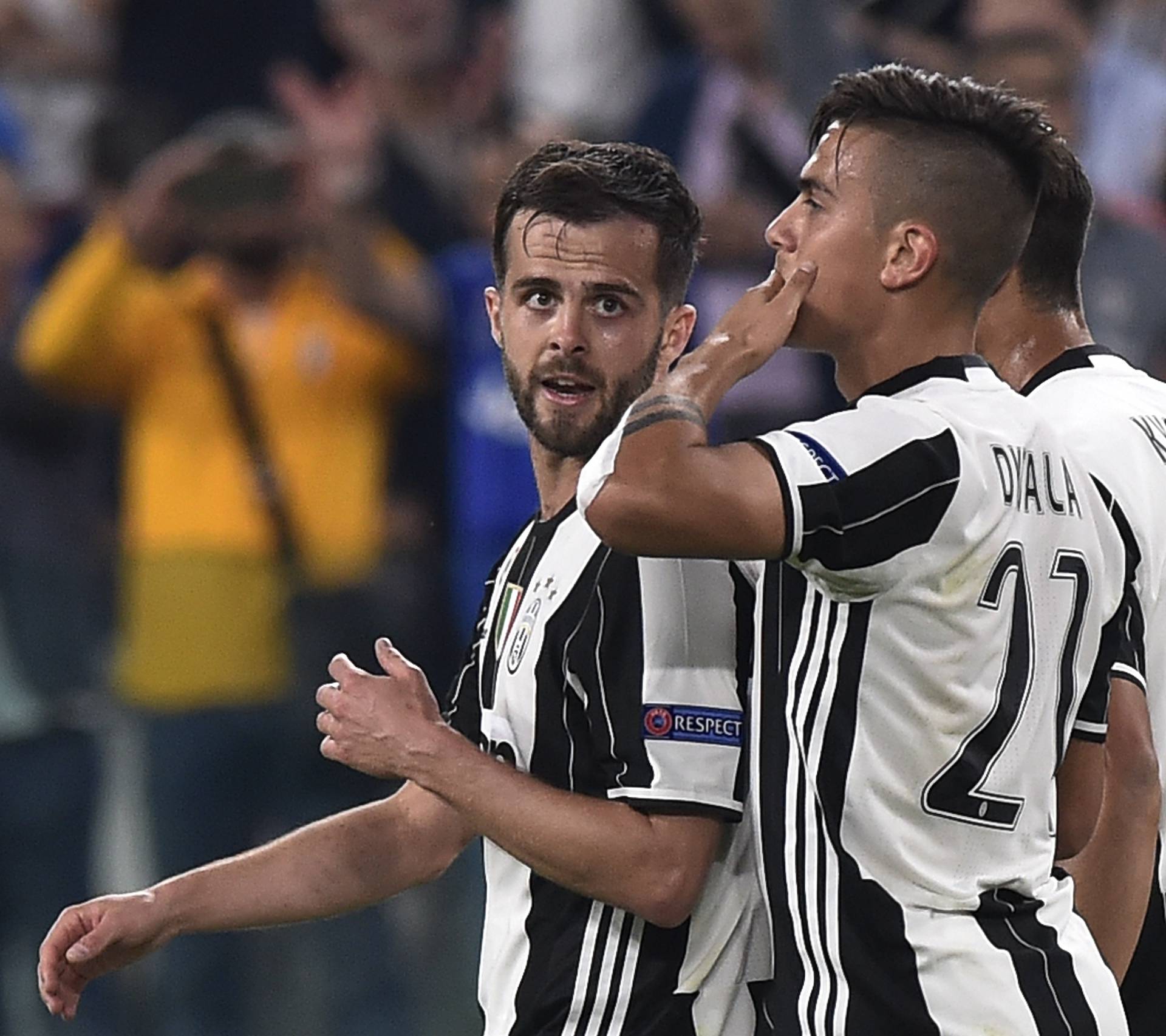 Juventus' Paulo Dybala celebrates scoring their second goal with Miralem Pjanic