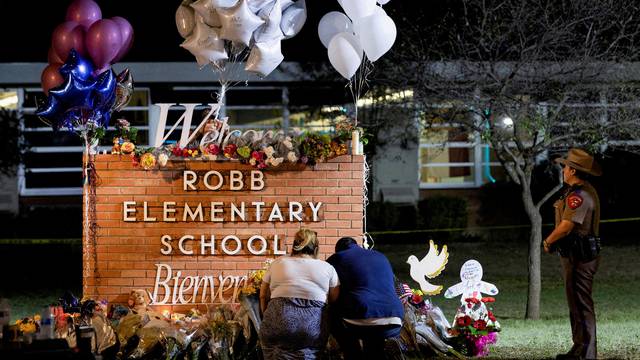 FILE PHOTO: People react after a mass shooting at Robb Elementary School in Uvalde