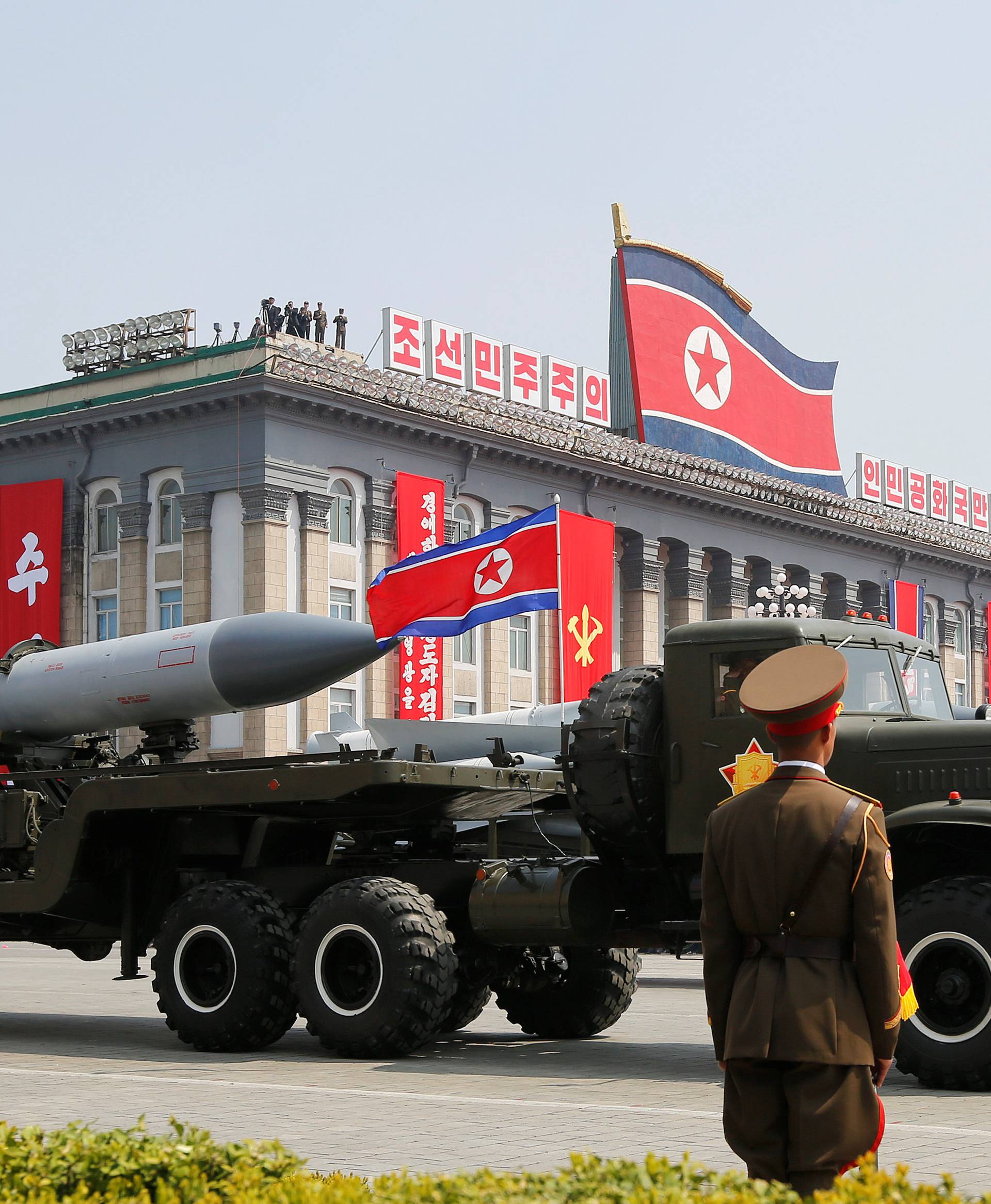 Missiles are driven past the stand with North Korean leader Kim Jong Un and other high ranking officials during a military parade marking the 105th birth anniversary of North Korea's founding father, Kim Il Sung, in Pyongyang