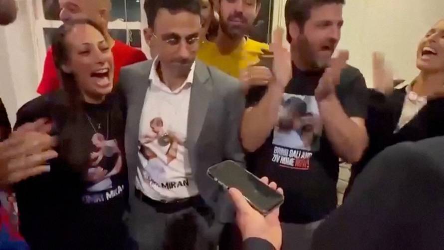Hostage family members and captivity survivors react as they speak to U.S. President Donald Trump, in Washington