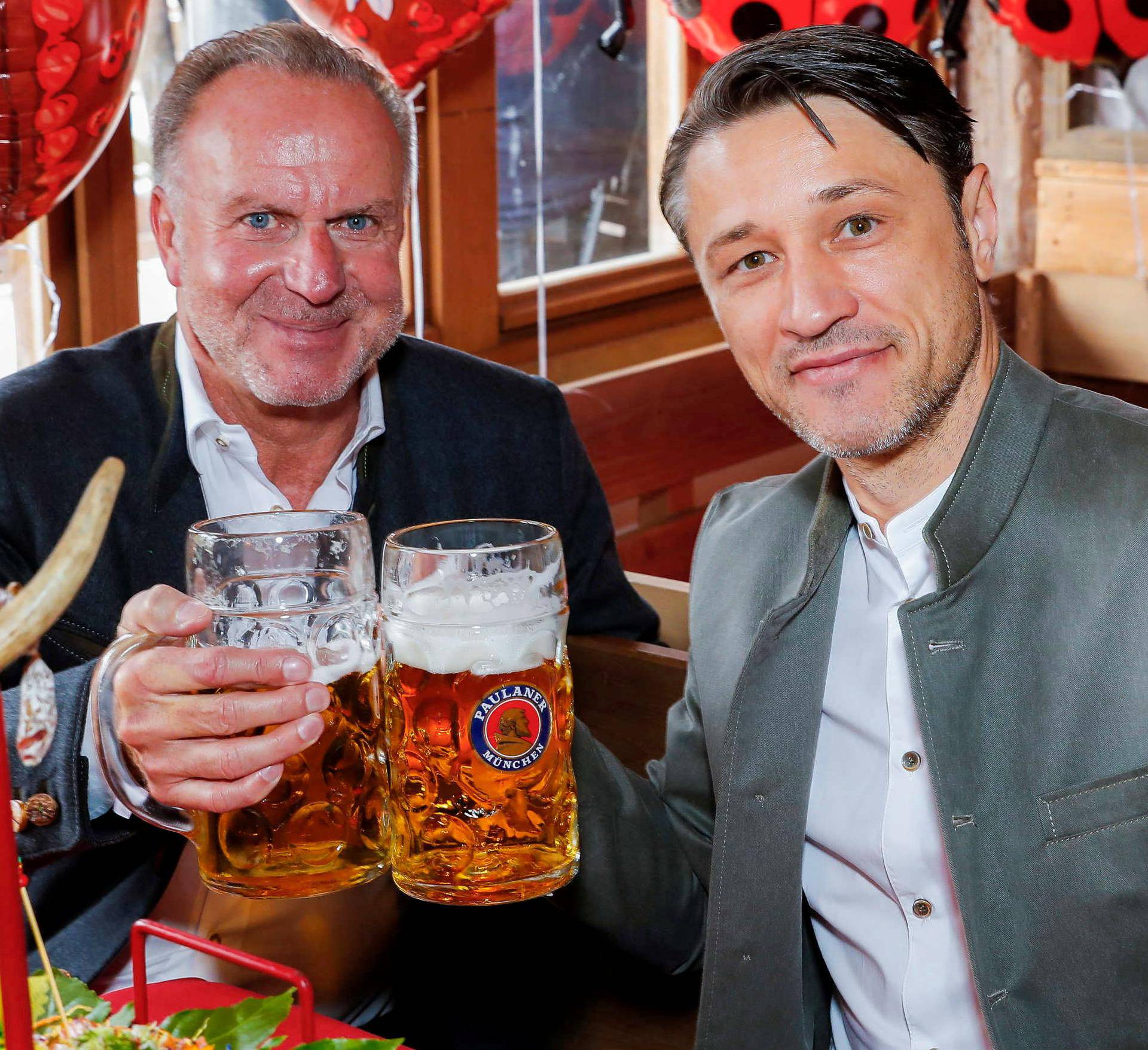 FC Bayern Munich's coach Niko Kovac and CEO Karl-Heinz Rummenigge pose during a visit at the Oktoberfest in Munich