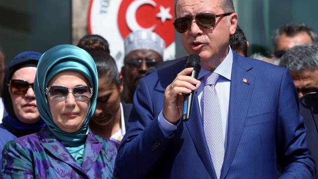 Turkish President Erdogan flanked by his wife Emine addresses guests during the opening ceremony of the new Turkish embassy in Abdiazizi district of Somalia's capital Mogadishu