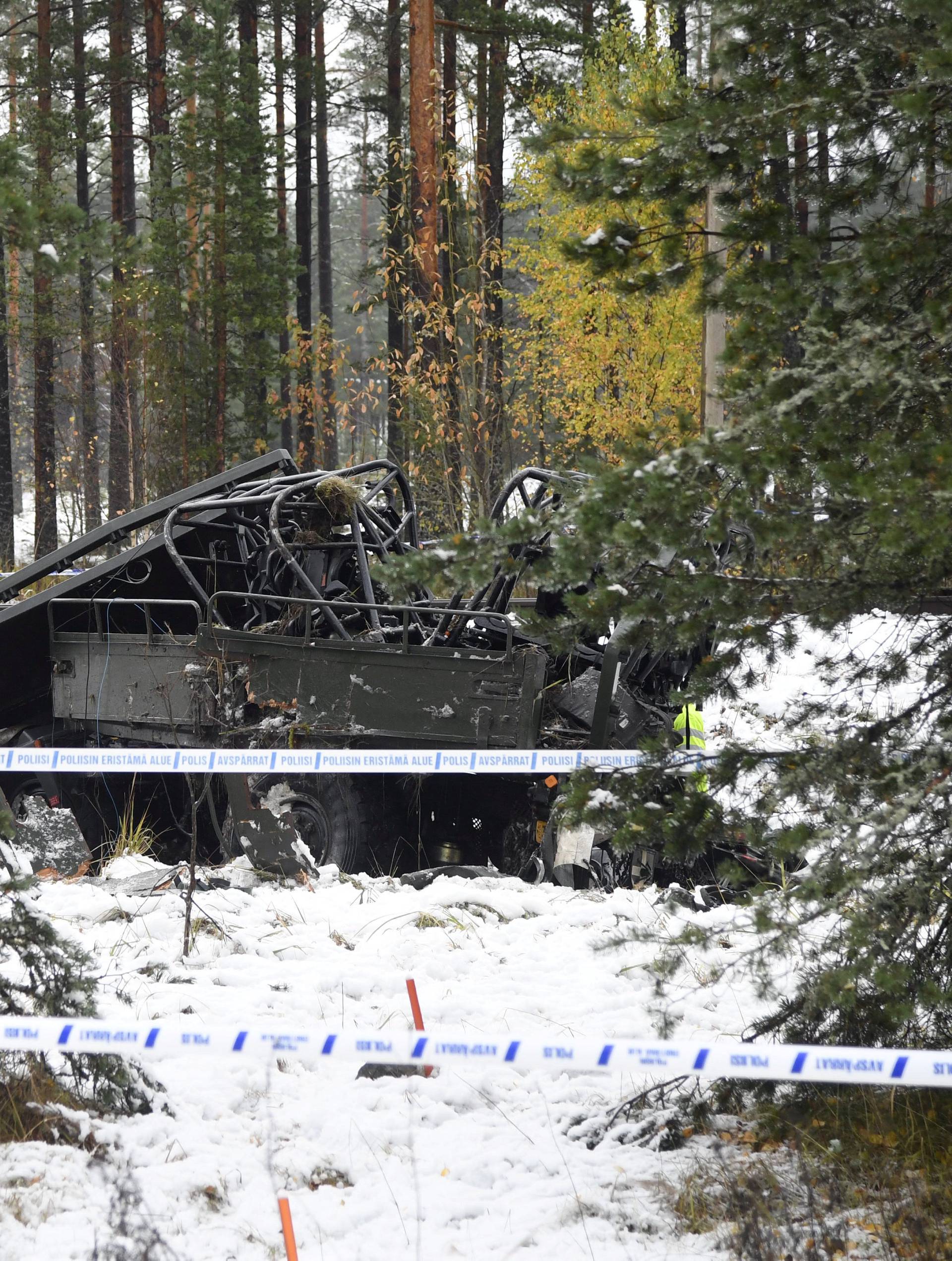 A military truck is pictured after a crash with a passenger train in Raasepori