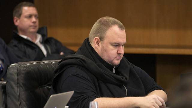 FILE PHOTO - German tech entrepreneur Kim Dotcom sits in a chair during a court hearing in Auckland, New Zealand
