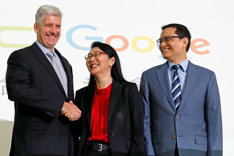Google hardware executive Rick Osterloh shakes hand with HTC CEO Cher Wang during a news conference to announce Google to acquire HTC's Pixel smartphone division, in Taipei
