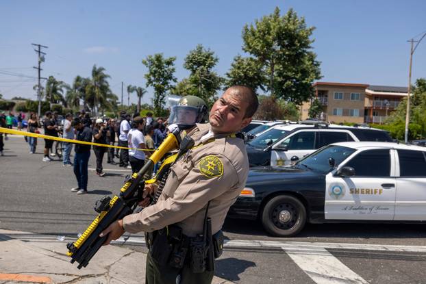 Standoff by protesters and law enforcement, following multiple detentions by ICE in Los Angeles County