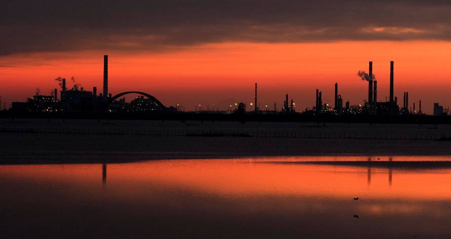 Docks are seen at sunset at the Industrial port of Marghera in the lagoon of Venice