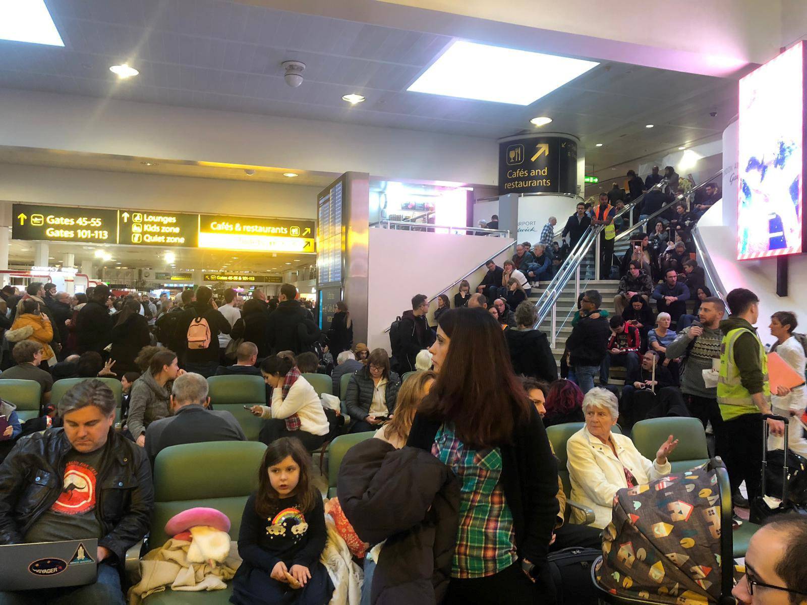 Stranded passengers wait at Gatwick Airport