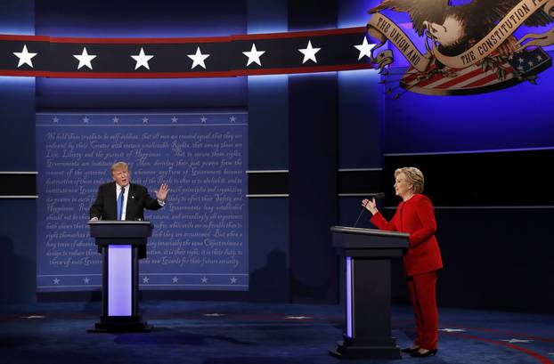 Republican U.S. presidential nominee Donald Trump and Democratic U.S. presidential nominee Hillary Clinton discuss a point during their first presidential debate at Hofstra University in Hempstead