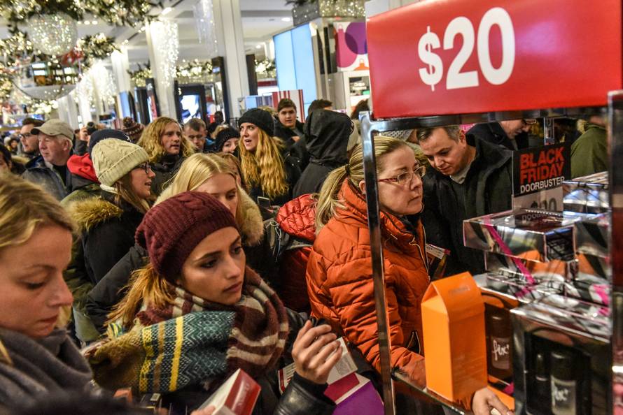 People shop during a Black Friday sales event at Macy's flagship store in New York City