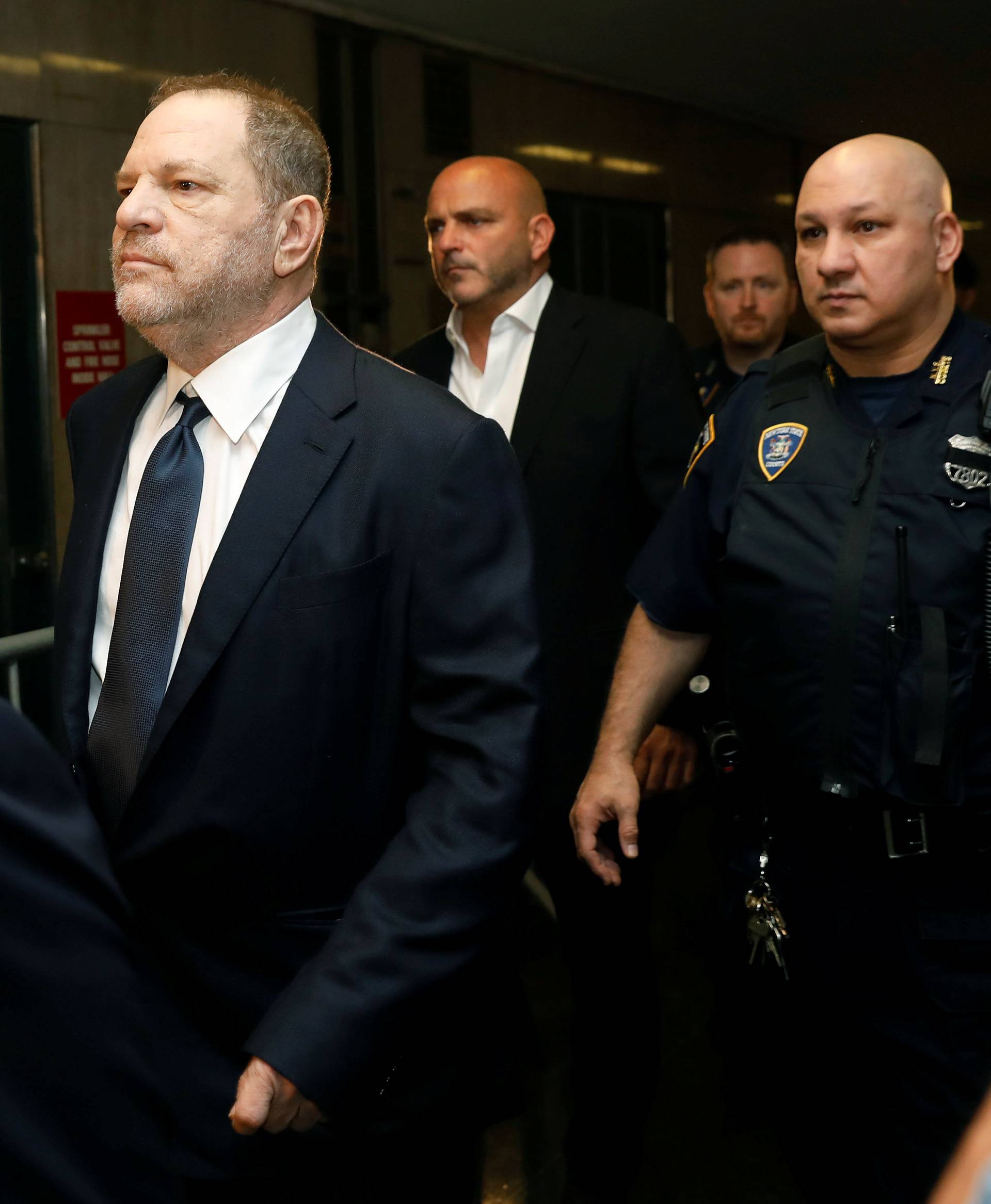 Film producer Harvey Weinstein arrives for his arraignment at Manhattan Criminal Court in New York