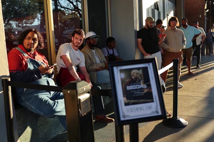 Fans wait in line to shave their heads for a free preview of Yorgos Lanthimos’s new film 'Bugonia', in California