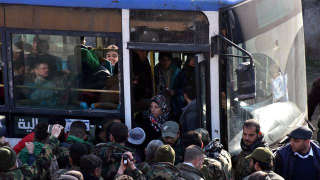 People who fled the Shi'ite Muslim villages of al-Foua and Kefraya arrive in government controlled Jibreen area in Aleppo