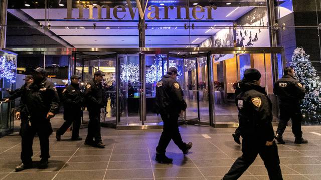 NYPD officers stand near the Time Warner Center Building after the building was evacuated due to a bomb threat, in the Manhattan borough of New York City