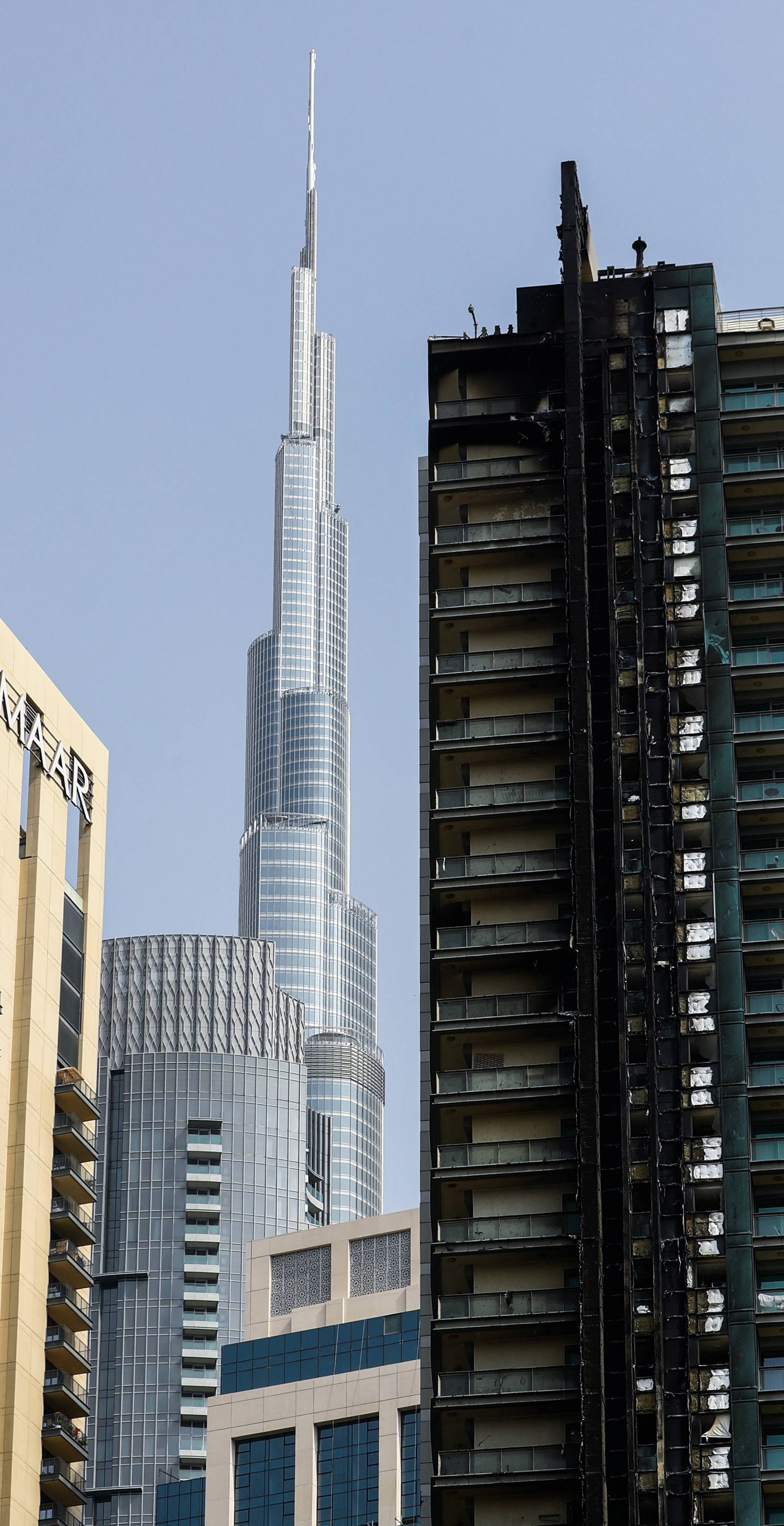 Fire damage is visible on the 8 Boulevard Walk high-rise building located near Burj Khalifa in Dubai