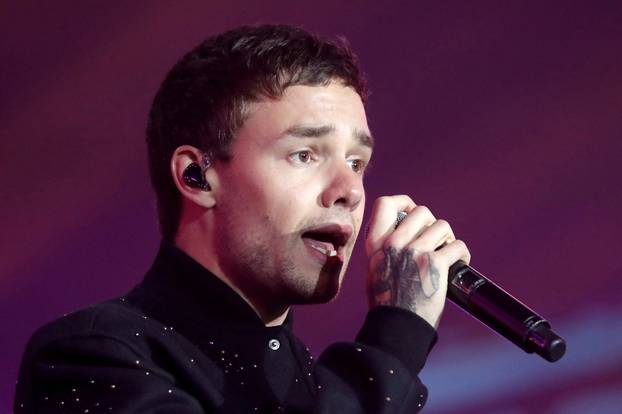 FILE PHOTO: British singer Payne performs on stage during a concert in front of the Hotel de Ville to celebrate Paris as host for the 2024 Summer Olympic Games