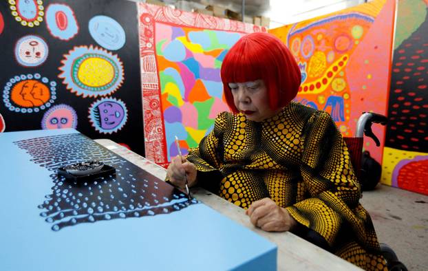 FILE PHOTO: Japanese avant-garde artist Kusama works on a creation at her studio in Tokyo