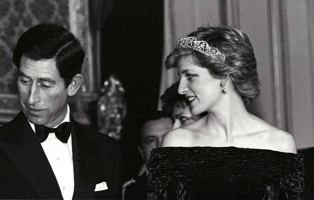 FILE PHOTO: PRINCESS OF WALES LOOKS TOWARDS HUSBAND CHARLES AT BANQUET AT AJUDA PALACE IN LISBON.