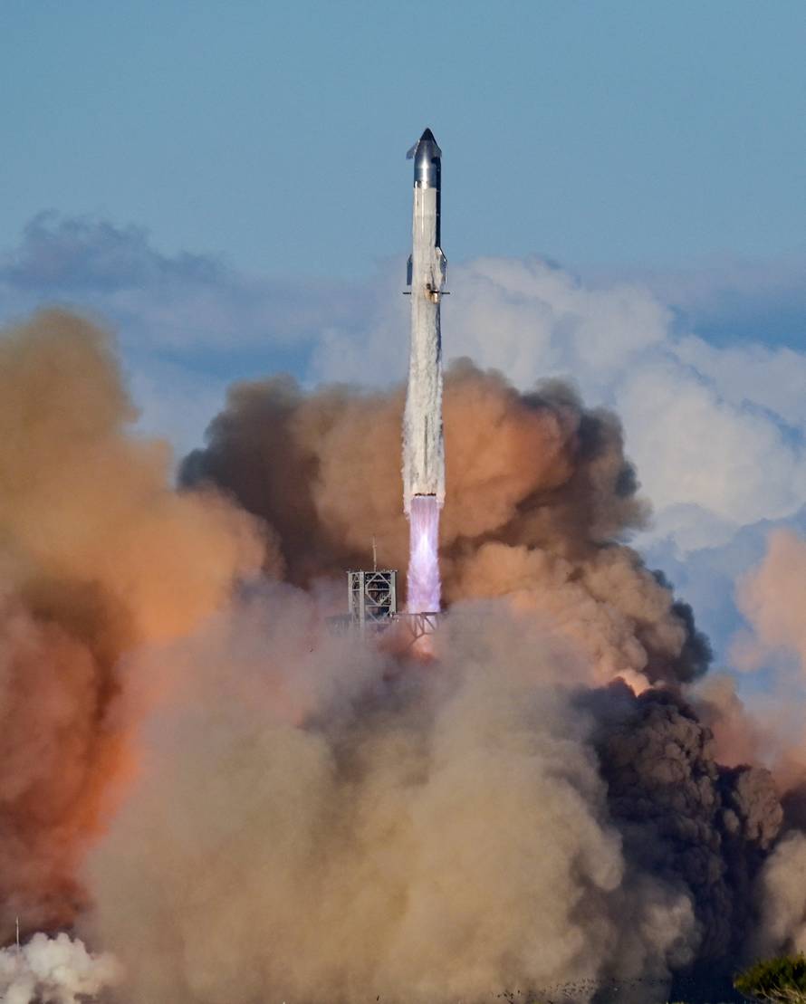 A SpaceX Super Heavy booster carrying the Starship spacecraft lifts off on its 11th test flight