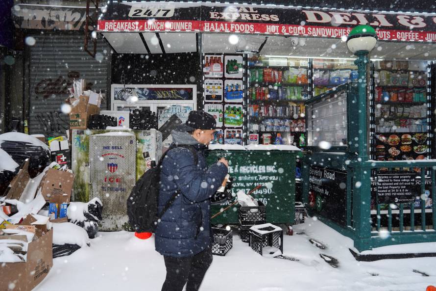A pedestrian walks past Sal Express Deli & Grocery, in Brooklyn