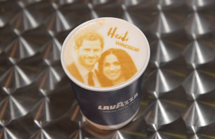 An image of Britain's Prince Harry and his fiancee Meghan Markle is seen on top of a cup of coffee being sold ahead of their forthcoming wedding in Windsor, Britain