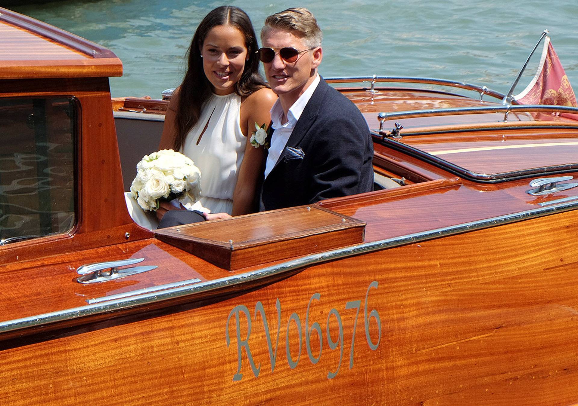 German football player Schweinsteiger and Serbian tennis player Ivanovic sit in a boat after get married in Venice