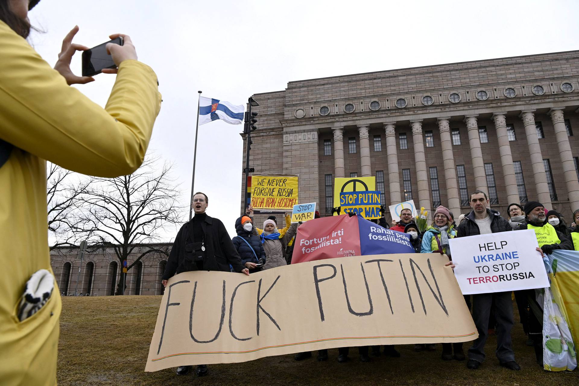 People attend a demonstration in support of Ukraine in Helsinki
